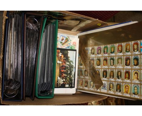 A BOX OF STAMPS, FIRST DAY COVERS AND TOKENS ETC