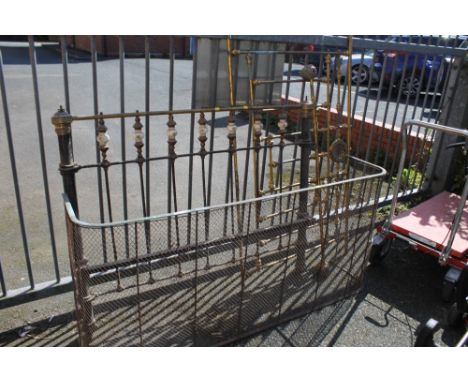 TWO ANTIQUE METAL BEDHEADS TO INC A BRASS EXAMPLE, TOGETHER WITH A LARGE FIREGUARD (2)