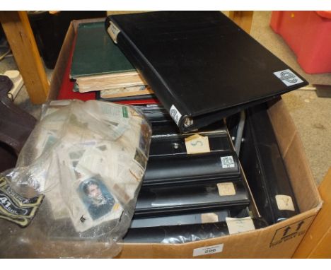 A LARGE QUANTITY OF VINTAGE STAMPS ALBUMS, CIGARETTE CARDS ETC