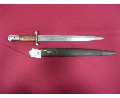 1903 Pattern SMLE Bayonet  11 3/4 inch double edged blade. Steel muzzle ring, crossguard and pommel. Wooden slab grips. Conta