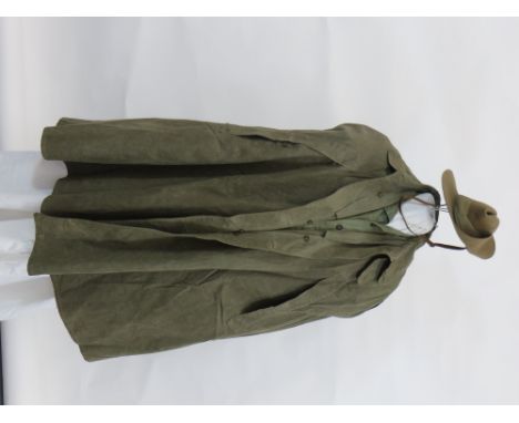 Scarce WW2 Far East Tropical Monsoon Cape  dark green canvas cape. Front fastening. Large fold over collar. Angled chest slit