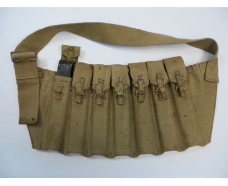 Rare 1944 Dated Airborne Pattern Sten Magazine Bandolier  light khaki webbing bandolier. The front with seven magazine compar