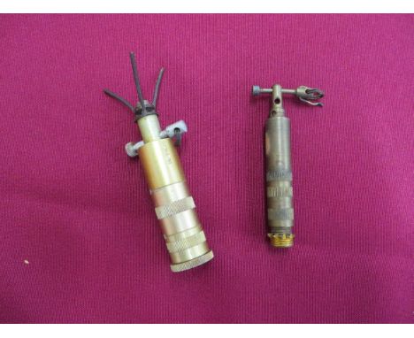 Two Small Military Fuses  consisting tubular brass fuse with top plunger. The body stamped “R” and reverse “R” with “90” ... 
