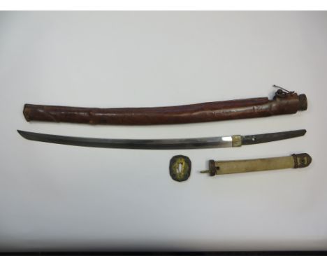 Japanese Signed Tang Shin-Gunto Officer’s Sword  24 inch single edged blade with hammon edge decoration. Plated brass habaki.