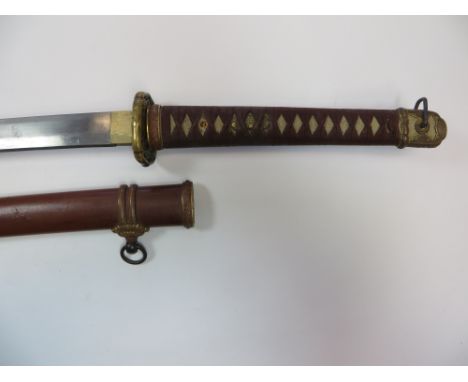 WW2 Japanese Officer’s Shin-Gunto Sword  27 1/2 inch late production single edged blade. Brass habaki. Brass military pattern