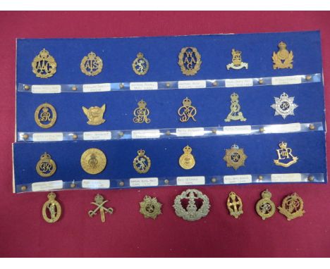 Selection of Corps Cap Badges  including KC brass Queen Mary’s Army Auxiliary Corps ... KC brass ATS ... Darkened WAAC ... Br