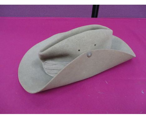 1942 Dated Bush Hat  khaki felt wide brim hat with turn up to the left side secured by a press stud. Khaki linen puggaree ban