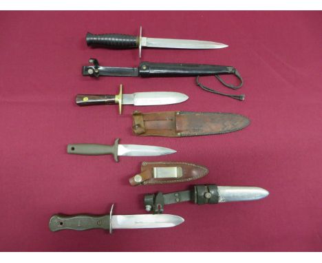 Four Various Combat Knives  consisting Wilson Sheffield combat knife. Double edged blade with maker’s details. Brass crossgua