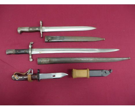 Three Various Continental Bayonets  consisting Schmidt Rubin M1918 bayonet. Double edged blade. The forte marked “Elsener Sch