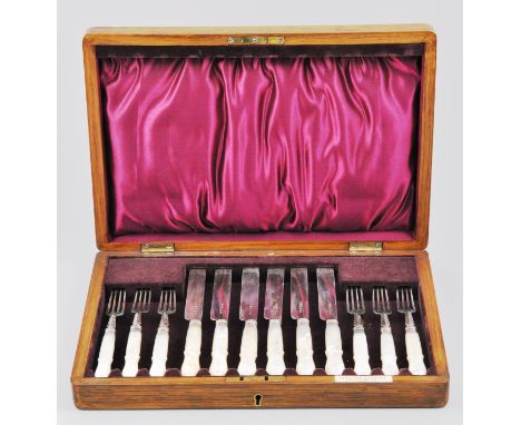 Set of six walnut cased silver and mother of pearl dessert knives and forks, the case marked Hamilton and Inches, Edinburgh.