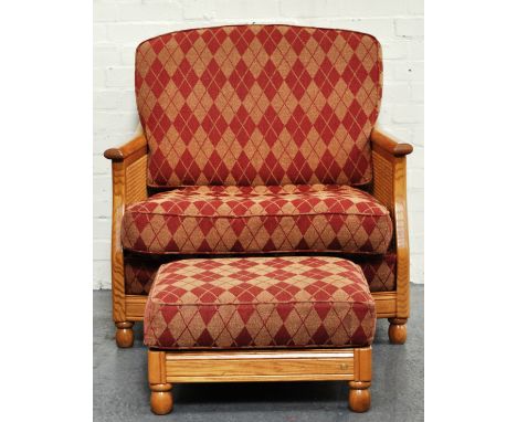 Modern Ercol Bergere armchair, with diamond patterned upholstery and an accompanying stool (2).