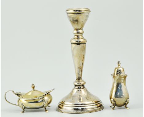 Hallmarked silver candlestick, Birmingham, a cruet, napkin rings etc (8).