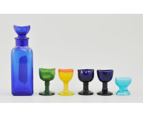 Large collection of glass and ceramic eye baths, including lustre yellow and green Vaseline, (2 boxes).