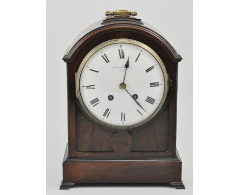 Mahogany cased bracket clock, with a French movement, dial signed Curtis and Holland, striking on a gong, on brass feet, heig