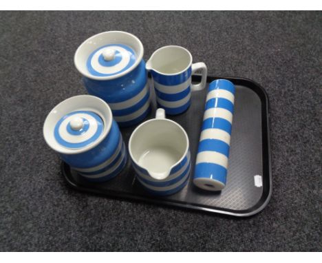 A tray containing five pieces of T.G. Green blue and white Cornish ware to include rolling pin, two jugs and two lidded stora