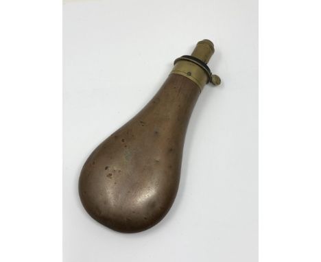 A 19th century brass and copper powder flask by James Dixon &amp; Sons, Sheffield