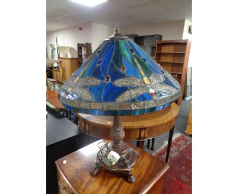 A Tiffany style table lamp with leaded glass shade depicting dragonflies  