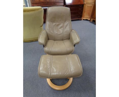 A Stressless leather swivel adjustable armchair with matching stool 