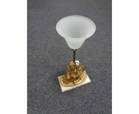 A nineteenth century gilt metal table lamp in the form of a cherub on marble base 