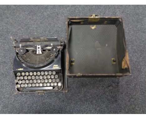 A vintage Remington home portable typewriter in case 