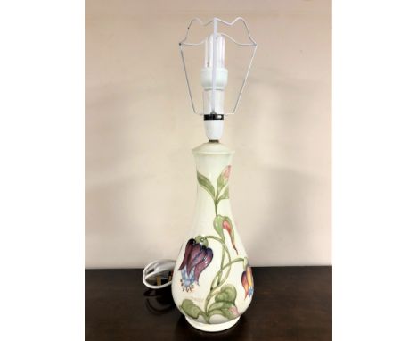 A Moorcroft table lamp on cream ground, height 40cm excluding bulb. 