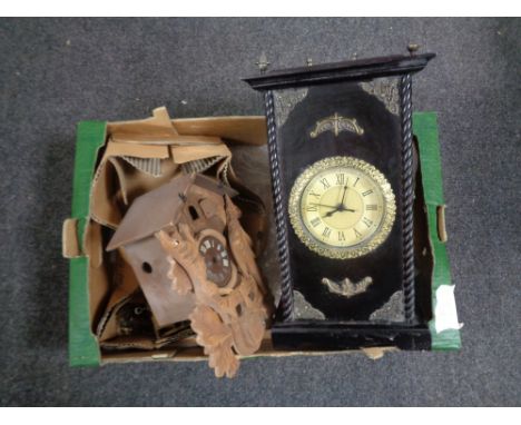 A box containing a contemporary battery operated wall clock in fitted cabinet together with a cuckoo clock (A/F). 