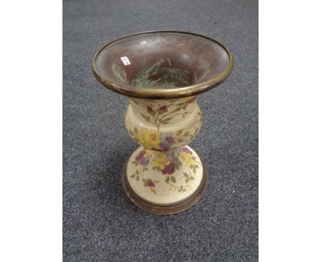 A nineteenth century brass and ceramic jardiniere stand 