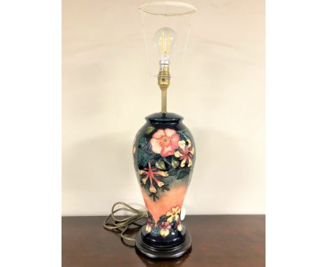 A William John Moorcroft pottery table lamp, height 45cm excluding bulb. 