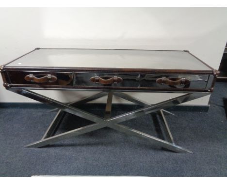 A contemporary leather framed mirrored three drawer console table on chrome X-frame support 