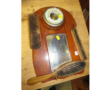 A VINTAGE OAK WALL MOUNTED VALET WITH BAROMETER AND MIRROR TOGETHER WITH A PAIR OF BARLEY TWIST CANDLE STICK