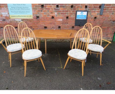 AN ERCOL LIGHT ELM EXTENDING DINING TABLE WITH SIX HOOP BACK ERCOL CHAIRS  TABLE- L-152 CM - EXTENDS TO 223 CM