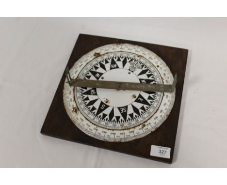 A VINTAGE COMPASS