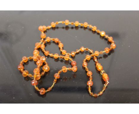 AN ART DECO AMBER BEAD NECKLACE