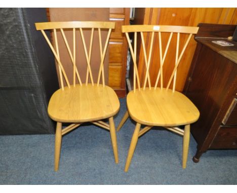 A PAIR OF ERCOL LIGHT ELM STICK BACK CHAIRS