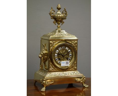 Late 19th century French gilt metal mantel clock, case with cast urn pediment and moulded with foliage, lion mask handles, br