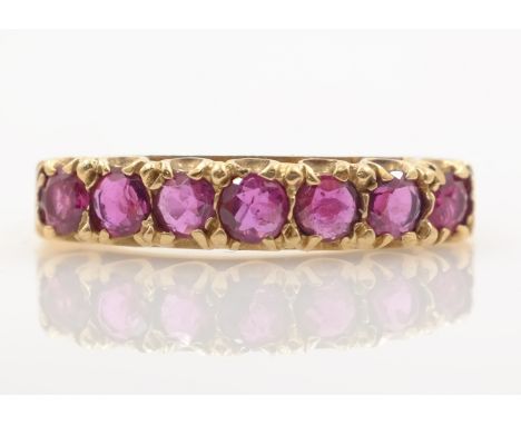 Gold seven stone ruby ring hallmarked 9ct    Condition Report  Approx 2.5gm, size S-T Click here for further images, conditio