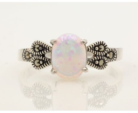 Silver opal and marcasite ring stamped 925   Condition Report   Click here for further images, condition, auction times & del