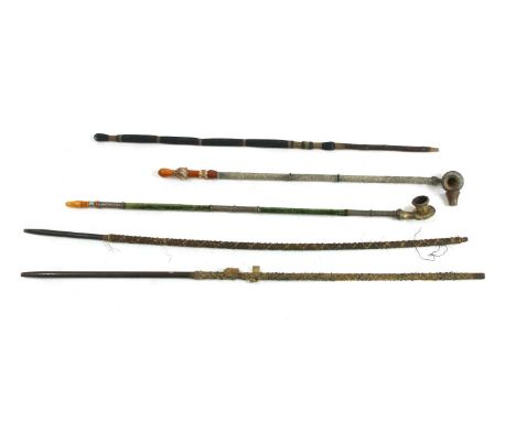 Two gilt and silvered metal chibouk pipes,each with flat bottomed bowls, decorated with scrolls continuing along the sectiona