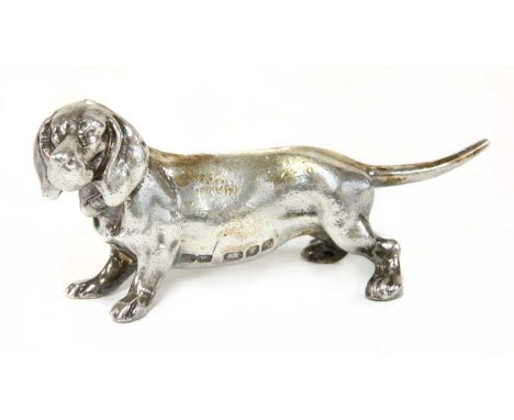 A cast silver figure of a dachshund,Whitehill Silver & Plate Co., London 1991,9cm wide, 4cm high, 5.5oztCondition report:The 