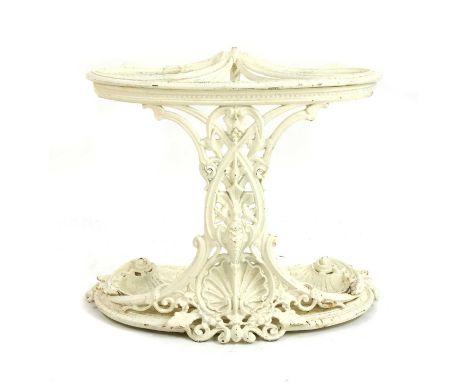 A Victorian Coalbrookdale cast iron stick stand, the pierced foliate scrolling front, set with shells and with two shell-shap