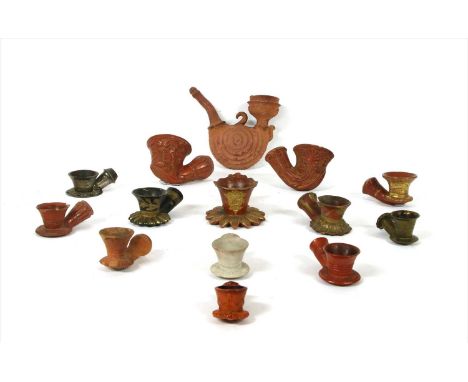 Fourteen Turkish chibouk bowls,in red and black clay, two in metal, some with gilt details, two with beaded shafts, largest 4