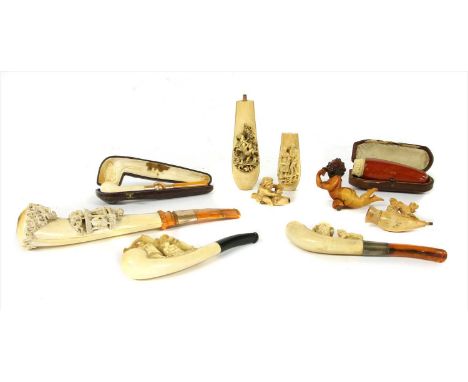 Nine meerschaum pipes and cheroot holders,late 19th century, Austrian, all carved with figures, one cased, largest, 22cm long