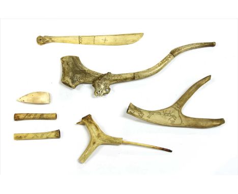 A collection of Scandinavian antler pipes and objects,19th century, a three-section pipe decorated with deer and scrollwork, 