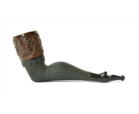 A Boer War novelty pipe,modelled as a lady's leg, carved to the bowl 'Zuid Afrikaansche Republiek 1899-1900-1901-1902' with a