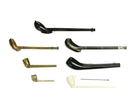 Three Dutch East Indies' wood and lacquer pipe cases,and two further brass cases,two with clay pipes, largest 27cm long (5)Pr
