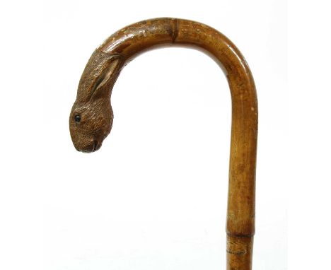 A Swaine &amp; Adeney hare walking stick,bamboo, the handle carved and painted with the head of a hare, stamped 'Swaine &amp;