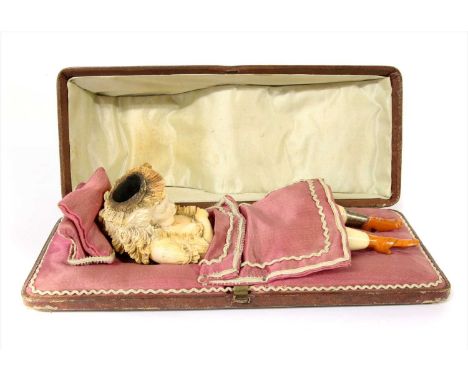 An erotic meerschaum combination cheroot holder and pipe,late 19th century, Austrian, the pipe modelled as a lady revealing h
