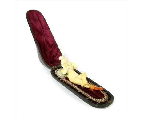 An erotic meerschaum combined cheroot holder and pipe,late 19th century, Austrian, modelled as a young woman holding a bunch 