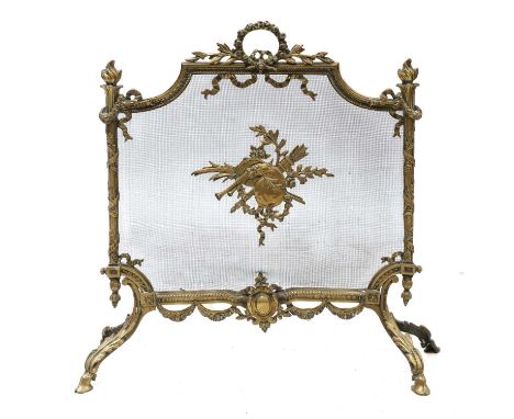 A French Louis XV-style cast gilt brass fireguard,late 19th/early 20th century, of shaped rectangular form, the mesh centred 