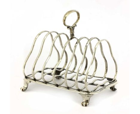 A Victorian six-division toast rack, by Hunt & Roskill (Late Storr & Mortimer), London 1854,of shaped form with leaf-decorate